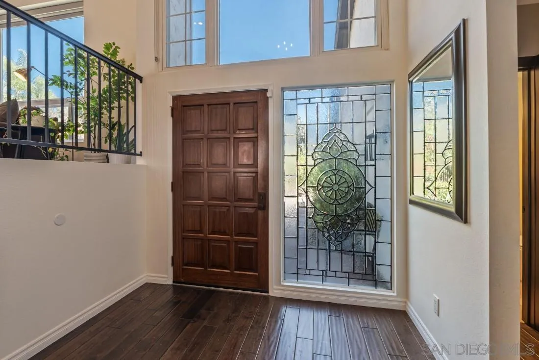 13060 Camino Del Valle Poway, CA 92064 - Photo 5 of 75 a view of a porch with wooden floor and a window