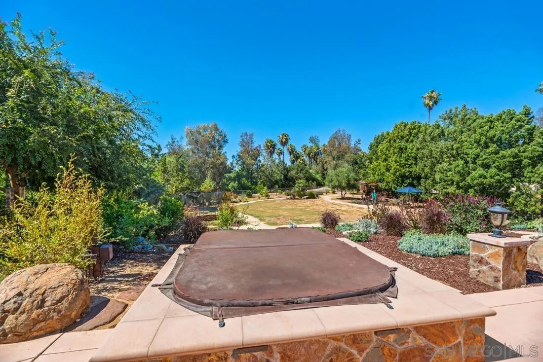 13060 Camino Del Valle Poway, CA 92064 - Photo 51 of 75 a view of a swimming pool with a yard and outdoor seating