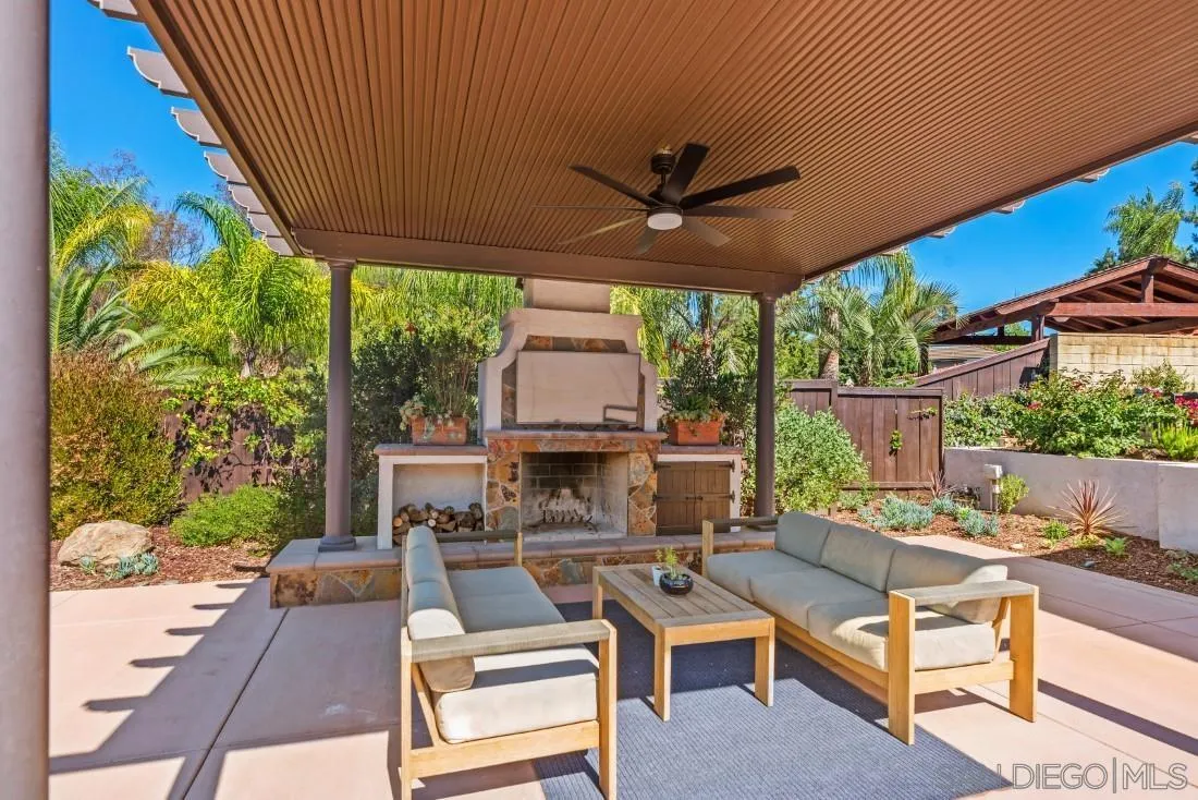 13060 Camino Del Valle Poway, CA 92064 - Photo 53 of 75 a living room with patio furniture and a floor to ceiling window