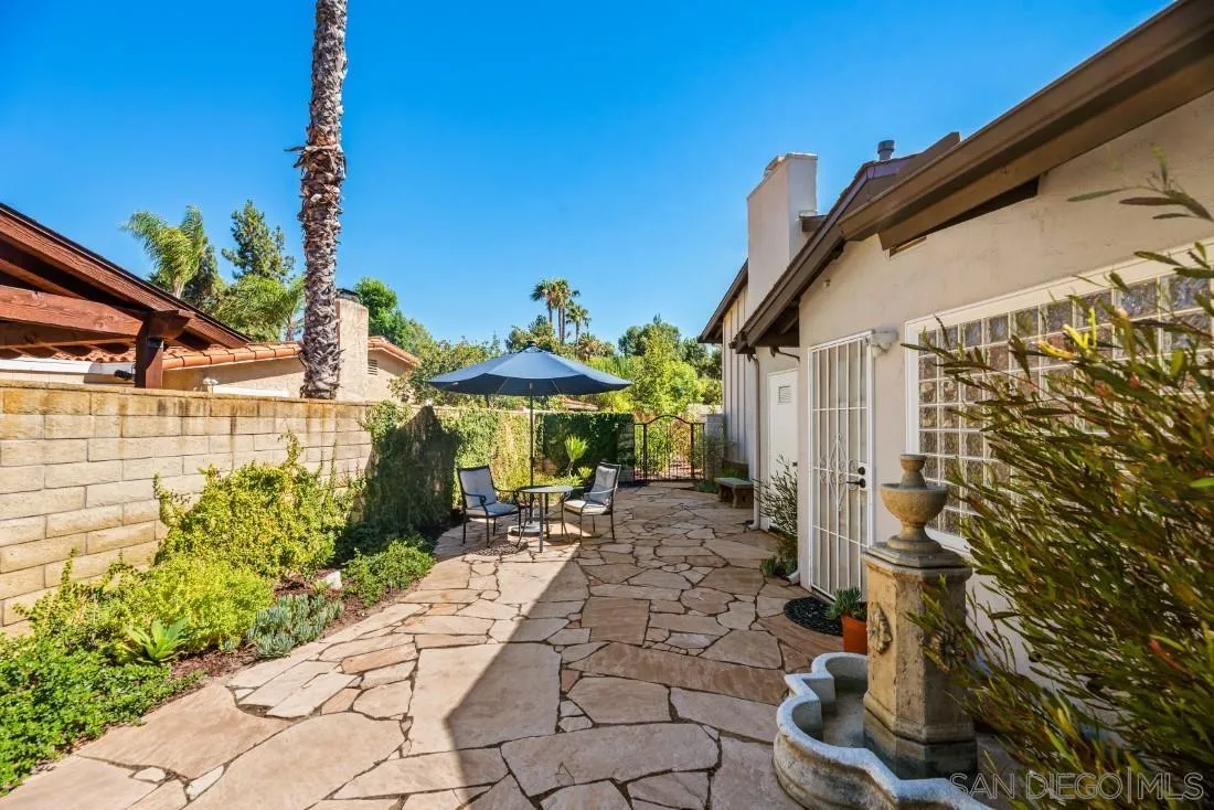 13060 Camino Del Valle Poway, CA 92064 - Photo 55 of 75 a patio with table and chairs and potted plants