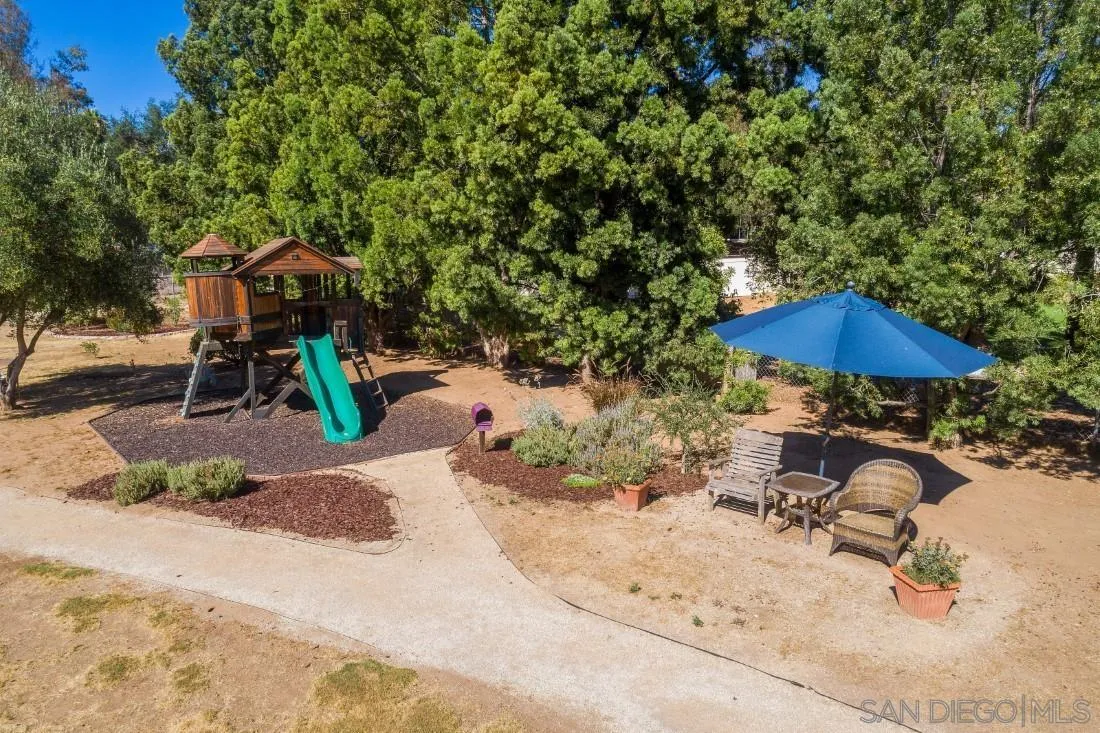 13060 Camino Del Valle Poway, CA 92064 - Photo 67 of 75 a view of backyard with a patio and outdoor seating