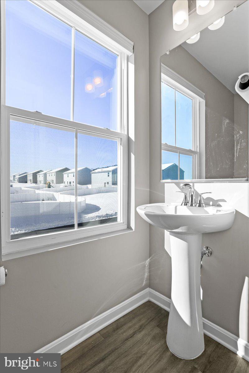 46 Scoter Road Hedgesville, WV 25427 - Photo 12 of 28 a bathroom with a sink and a mirror