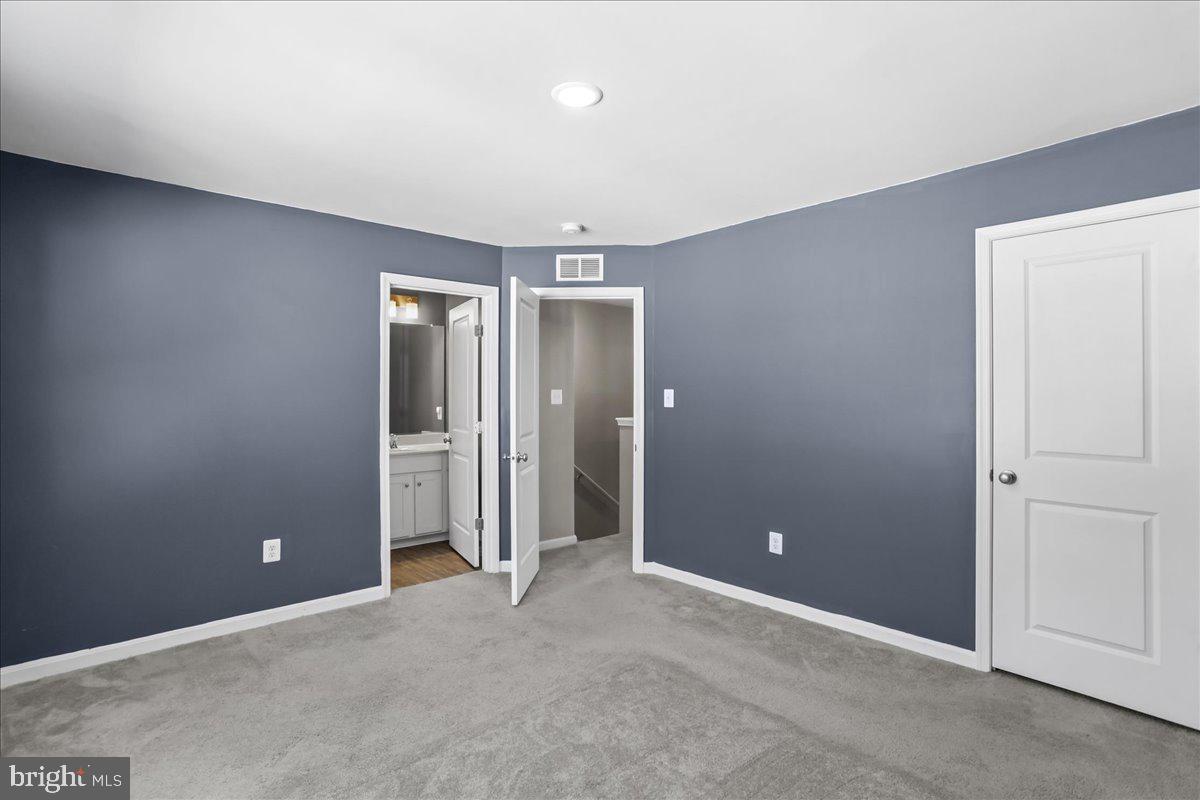 46 Scoter Road Hedgesville, WV 25427 - Photo 19 of 28 an empty room with closet and a bathroom