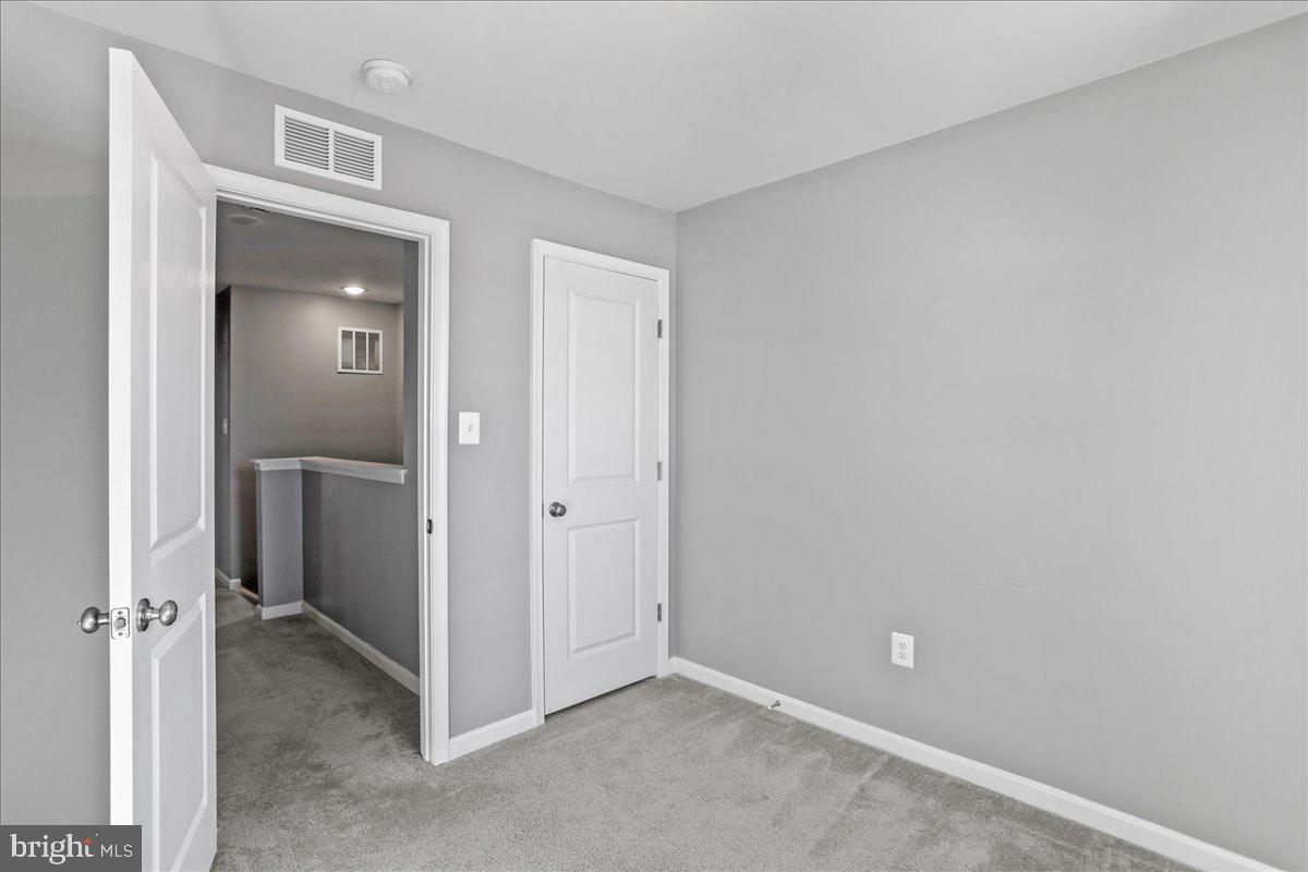 46 Scoter Road Hedgesville, WV 25427 - Photo 25 of 28 a view of an empty room with closet and a bathroom