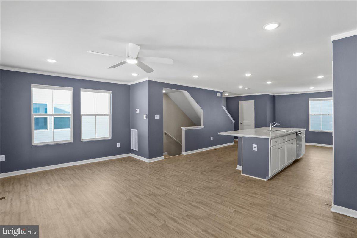 46 Scoter Road Hedgesville, WV 25427 - Photo 10 of 28 an open kitchen with kitchen island and stainless steel appliances