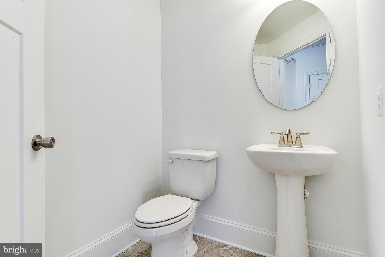 3526 Kemptown Church Road Monrovia, MD 21770 - Photo 15 of 29 a bathroom with a sink toilet and a mirror
