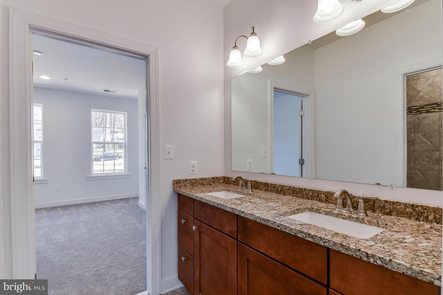 3526 Kemptown Church Road Monrovia, MD 21770 - Photo 19 of 29 a bathroom with a granite countertop sink and a mirror