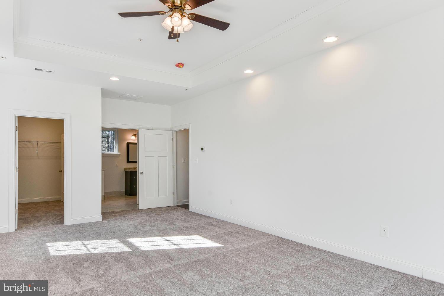 3526 Kemptown Church Road Monrovia, MD 21770 - Photo 25 of 29 a view of a livingroom with a ceiling fan and kitchen space