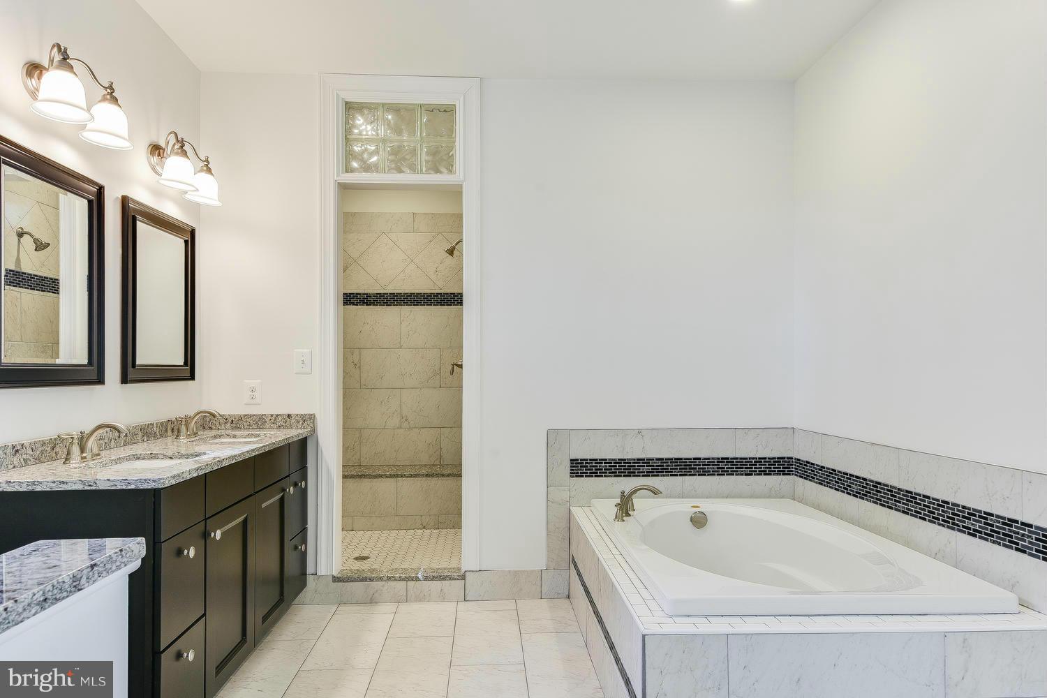 3526 Kemptown Church Road Monrovia, MD 21770 - Photo 26 of 29 a bathroom with a tub a sink and a mirror