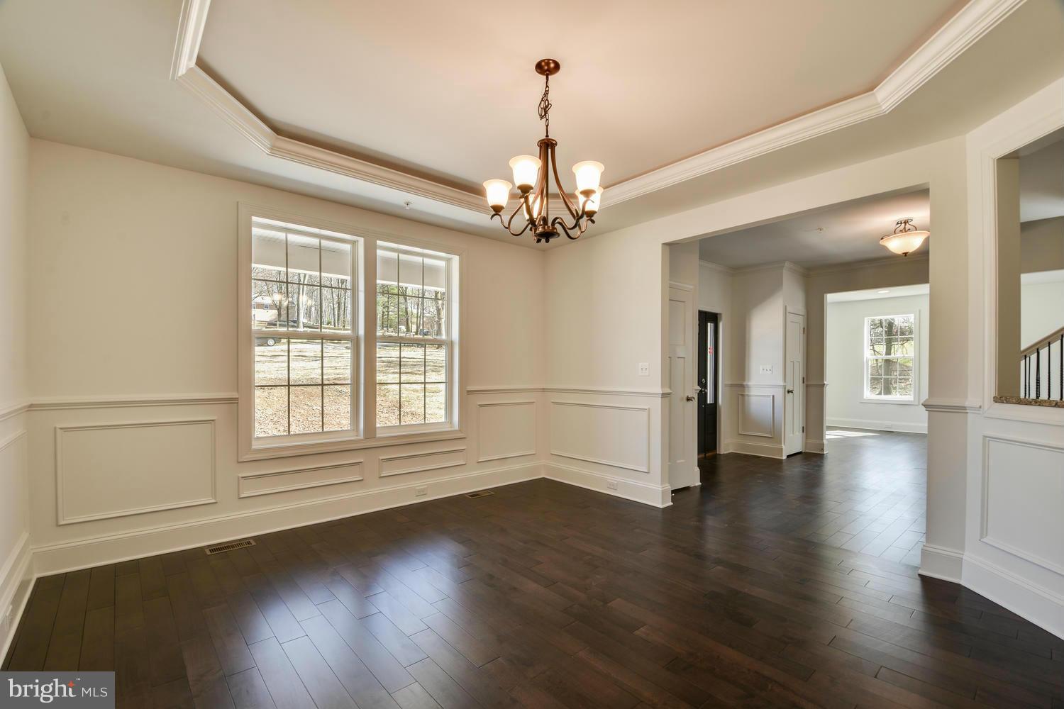3526 Kemptown Church Road Monrovia, MD 21770 - Photo 6 of 29 an empty room with wooden floor chandelier and windows
