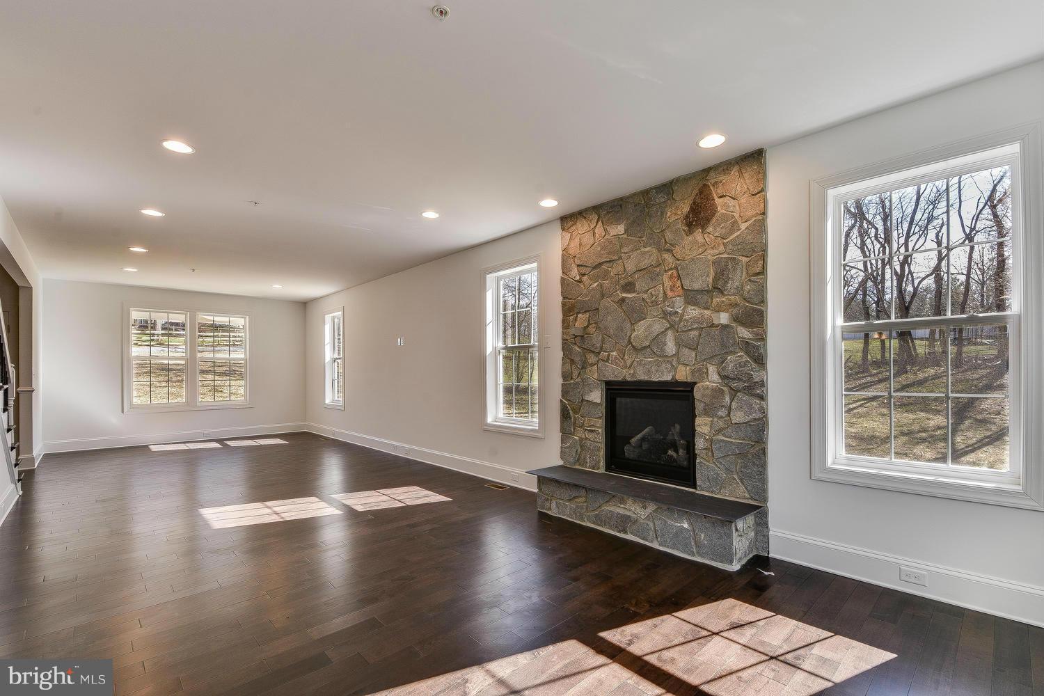 3526 Kemptown Church Road Monrovia, MD 21770 - Photo 8 of 29 an empty room with windows and fireplace