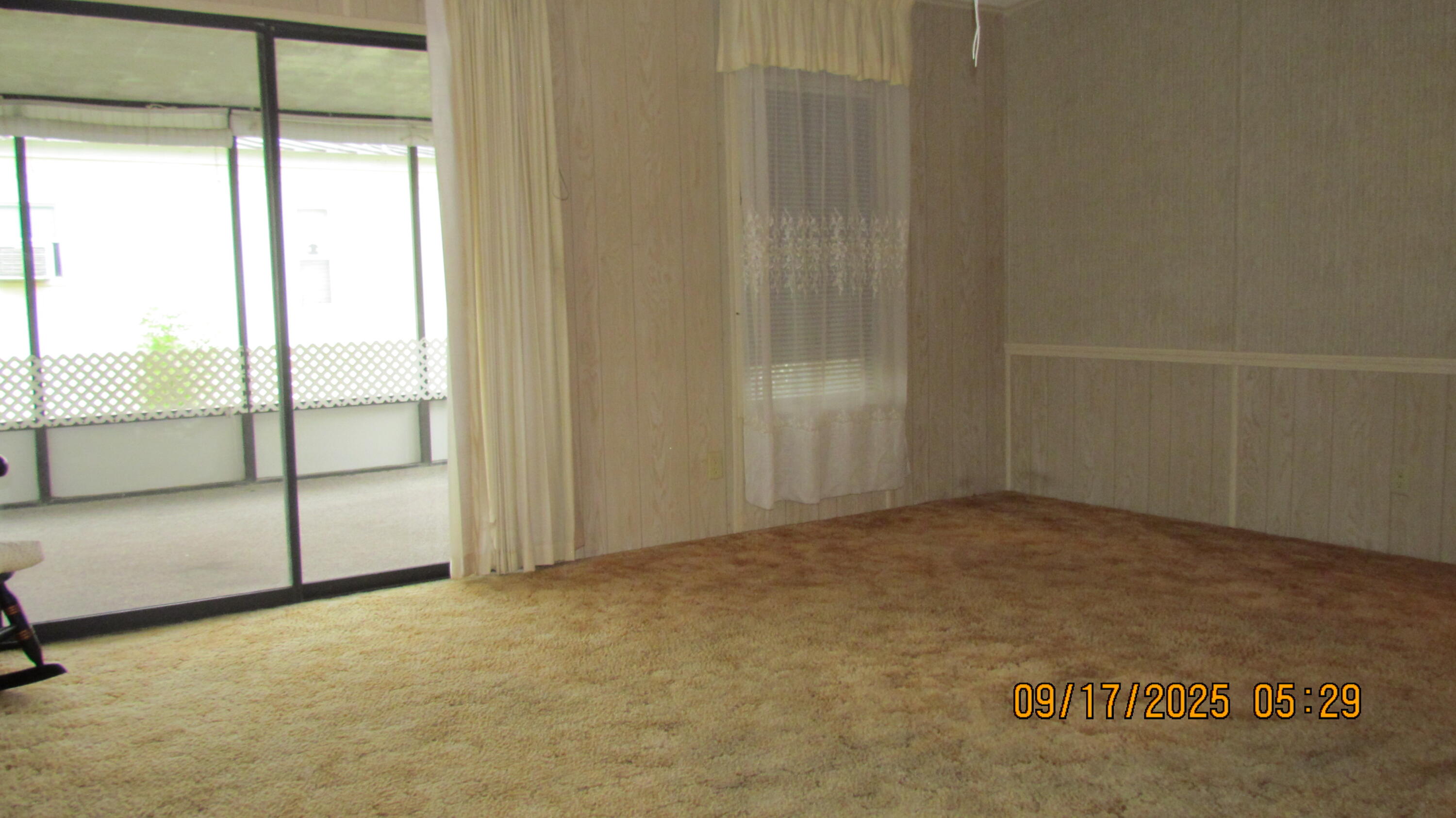 2828 Southwest Toronado Trail Stuart, FL 34997 - Photo 13 of 23 an empty room with sliding glass door