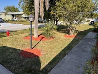 2828 Southwest Toronado Trail Stuart, FL 34997 - Photo 3 of 23 a view of a park with large trees