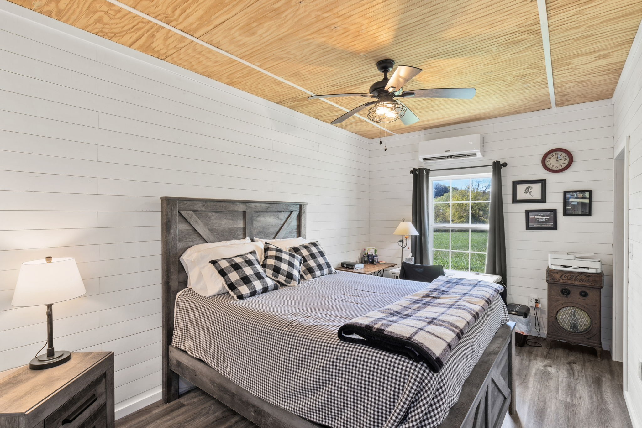 1818 Preacher Holt Road Mount Pleasant, TN 38474 - Photo 23 of 38 a bedroom with a bed a chandelier and a window