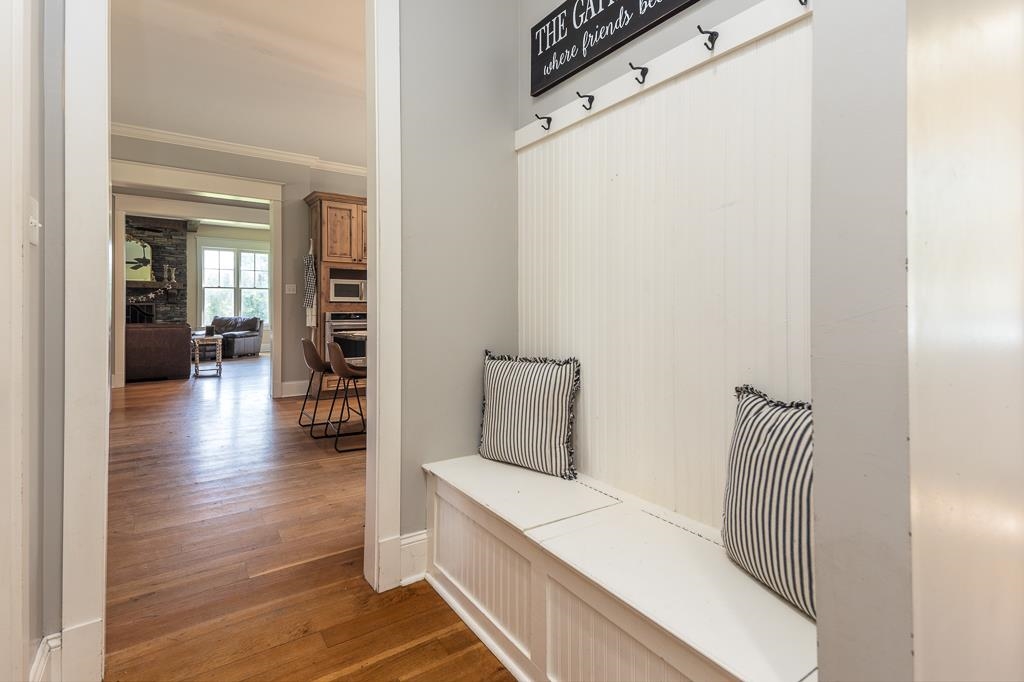 1915 Teague Store Road Somerville, TN 38068 - Photo 16 of 38 Entryway featuring built-in bench seating with beadboard paneling and coat hooks