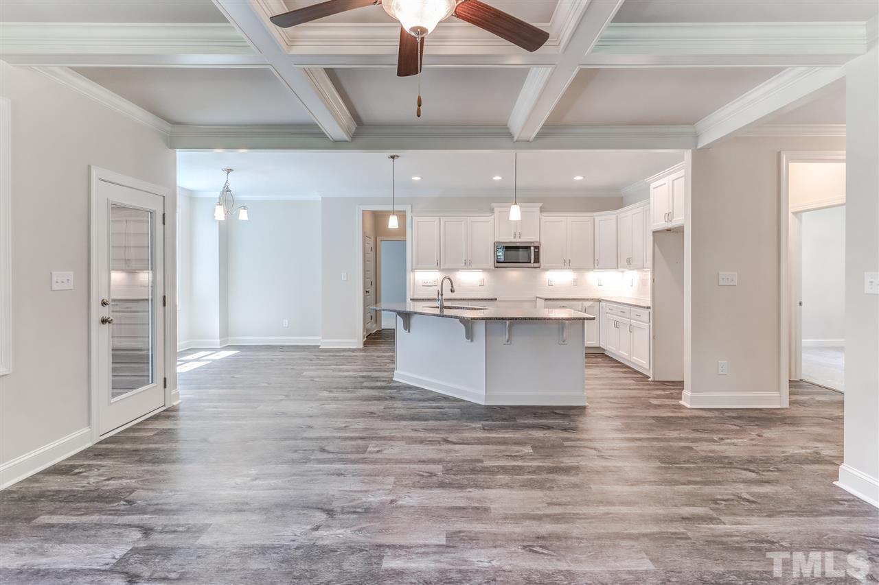2305 Pilot-Riley Road Zebulon, NC 27597 - Photo 8 of 20 a room with stainless steel appliances kitchen island granite countertop a large kitchen counter top a stove and a refrigerator