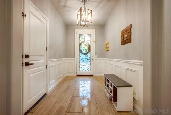 a view of a kitchen with wooden floor and a sink