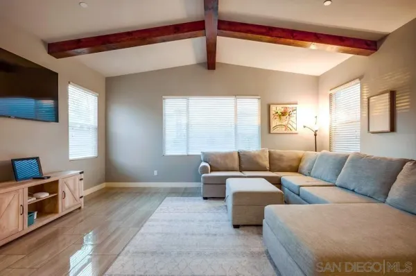 a large kitchen with lots of counter space and refrigerator view