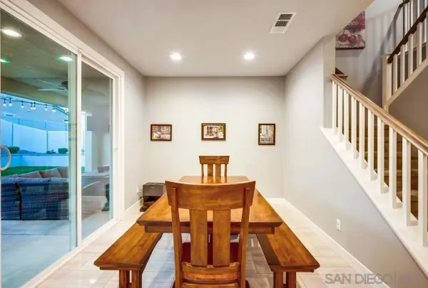 a kitchen with stainless steel appliances kitchen island granite countertop a refrigerator and a stove top oven