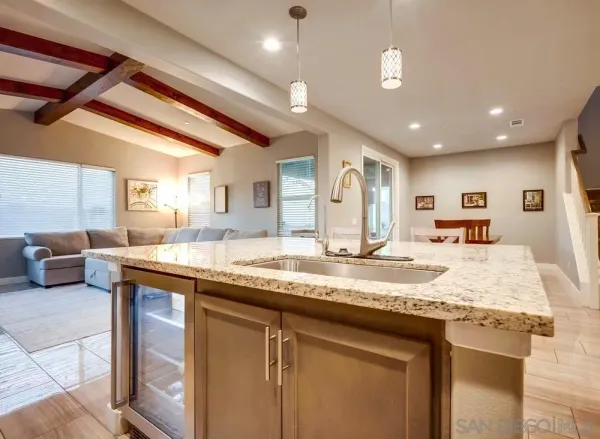 a bedroom with a bed and a ceiling fan