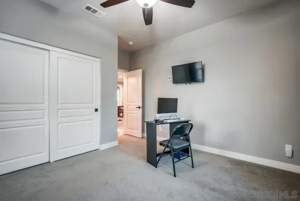 a spacious bathroom with a tub sink and mirror
