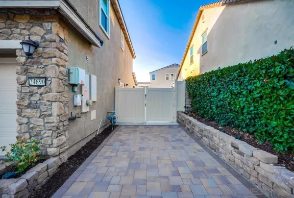 a view of a house with a yard and sitting area