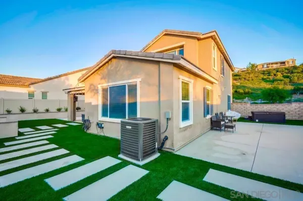 a house view with a outdoor space