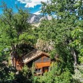 an aerial view of house with yard and outdoor seating