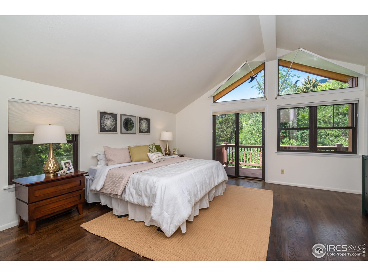375 16th Street Boulder, CO 80302 - Photo 15 of 30 a spacious bedroom with a bed and a large window