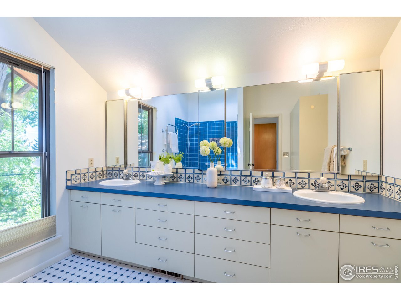 375 16th Street Boulder, CO 80302 - Photo 17 of 30 a bathroom with a sink double vanity granite and a mirror