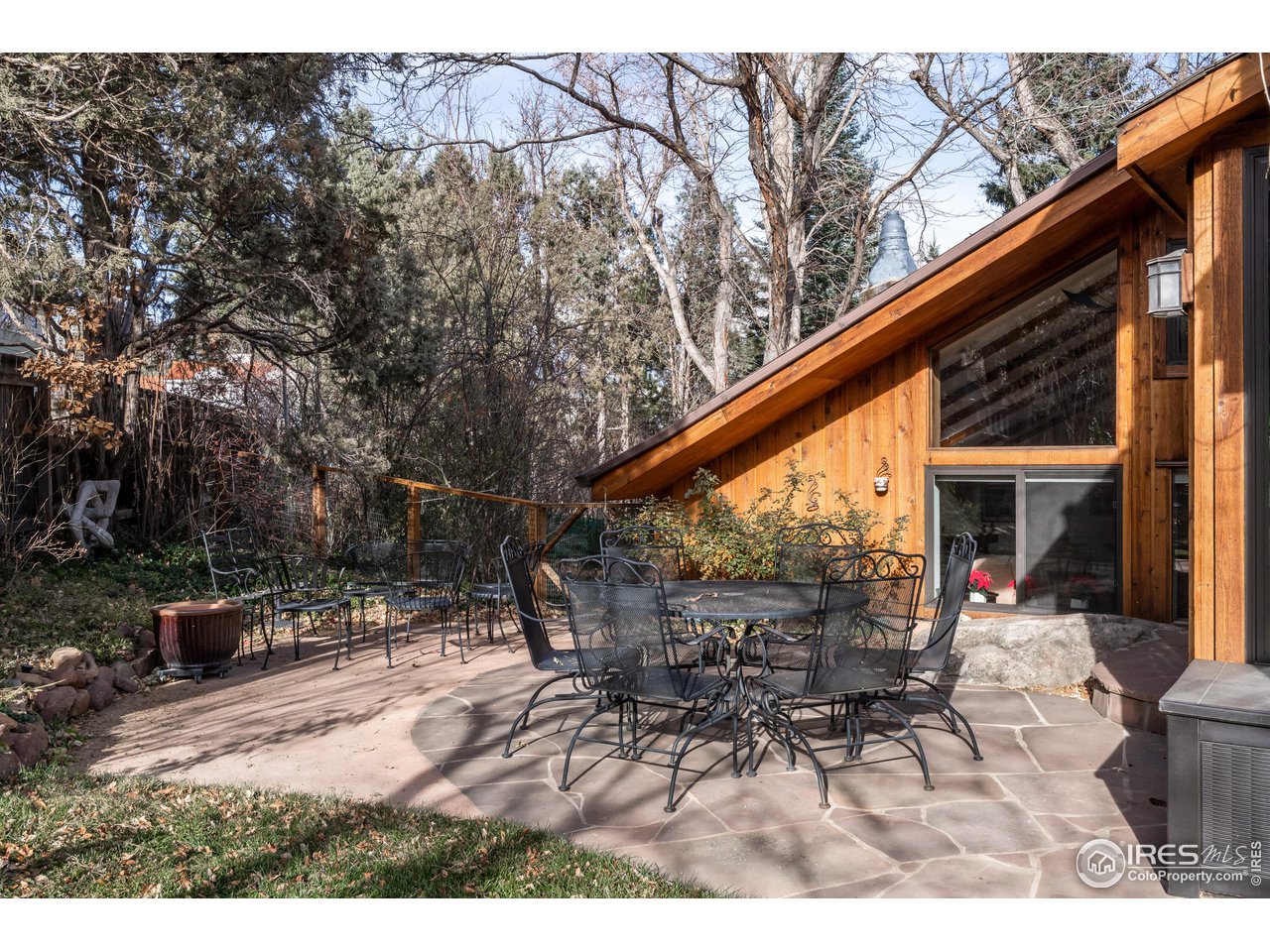 375 16th Street Boulder, CO 80302 - Photo 23 of 30 a backyard of a house with table and chairs