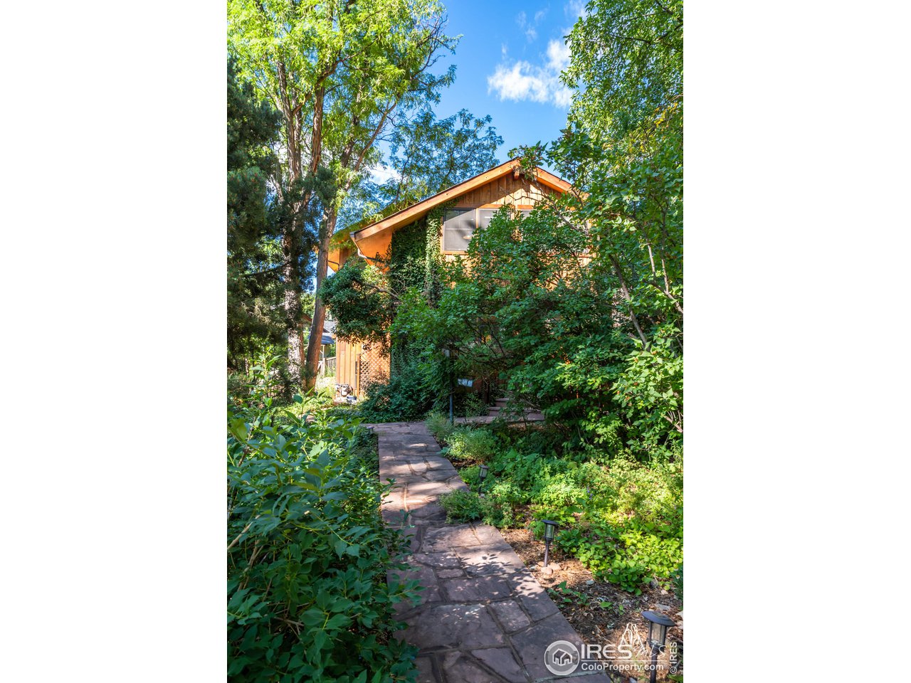 375 16th Street Boulder, CO 80302 - Photo 24 of 30 a backyard of a house with lots of green space