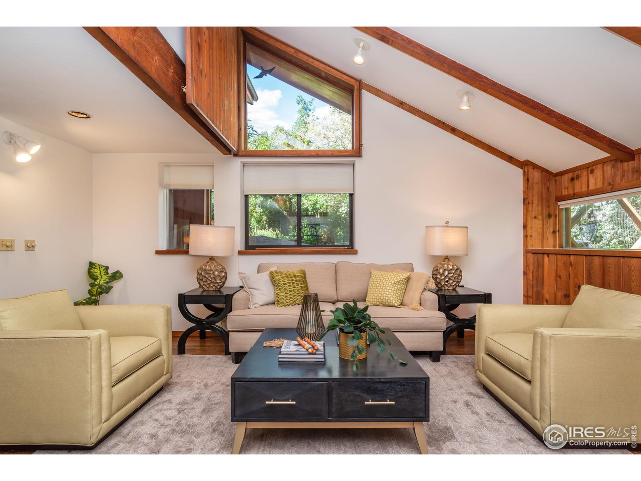 375 16th Street Boulder, CO 80302 - Photo 3 of 30 a living room with furniture a large window and a flat screen tv