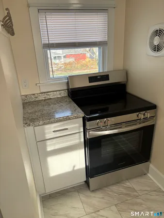 a view white cabinets and sink