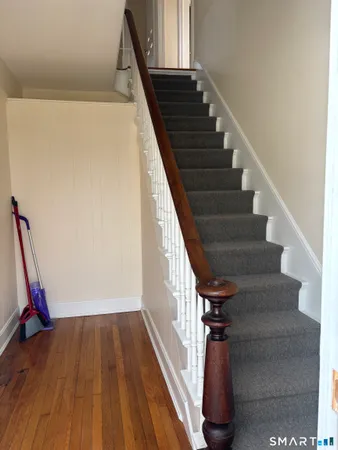 a view of entryway with wooden floor
