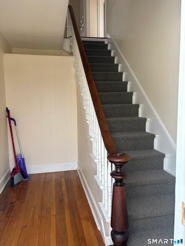 a view of entryway with wooden floor