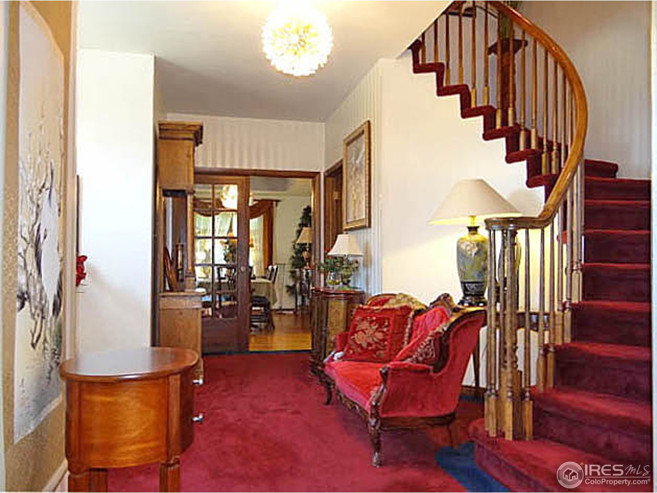 Gracious Foyer with Grand Curved Stairway