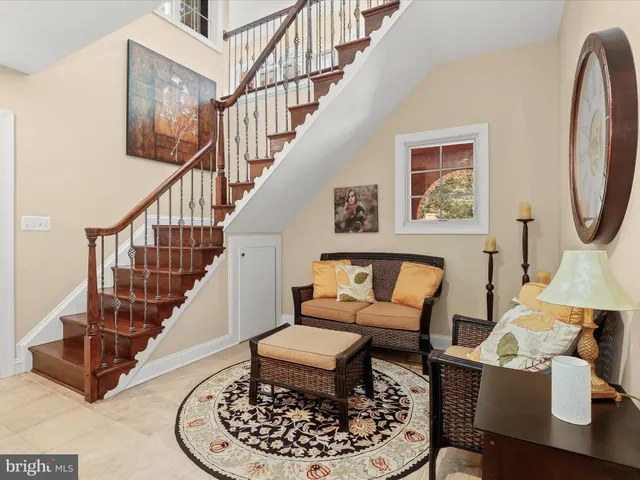 a room with furniture pool table and window