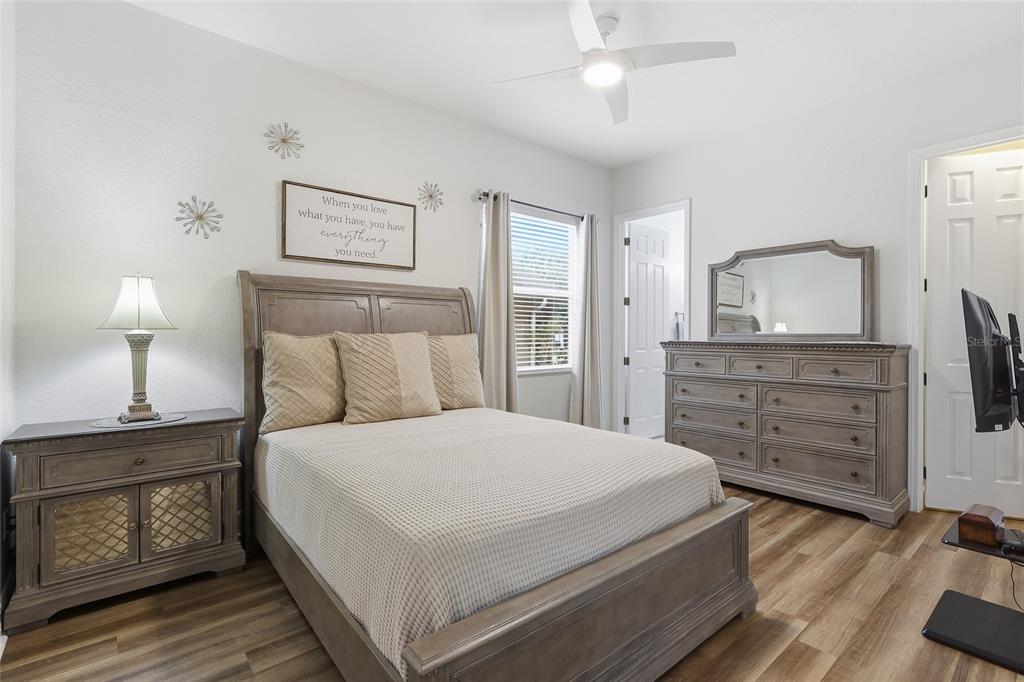 11749 Newberry Grove Loop Riverview, FL 33579 - Photo 26 of 54 a bedroom with a bed and a dresser