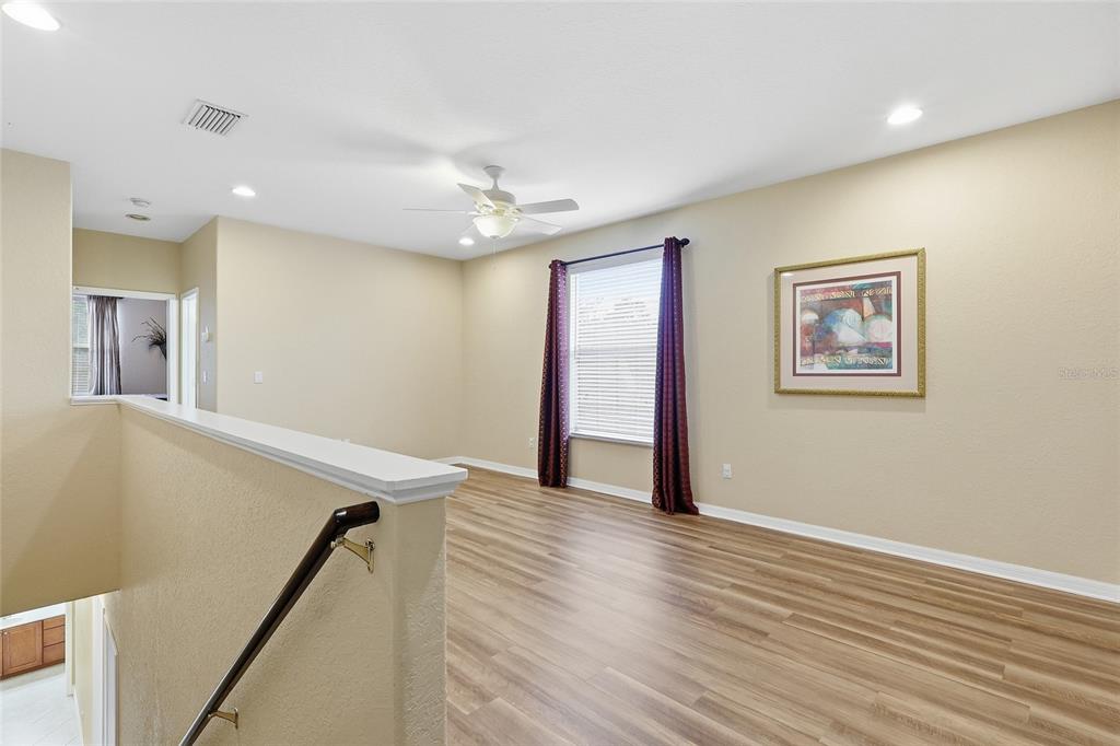 11749 Newberry Grove Loop Riverview, FL 33579 - Photo 32 of 54 a view of a hallway with wooden floor
