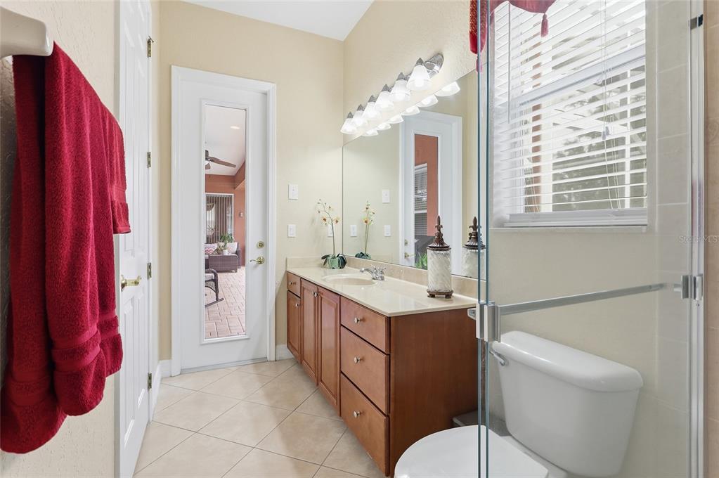 11749 Newberry Grove Loop Riverview, FL 33579 - Photo 40 of 54 a bathroom with a double vanity sink toilet and shower