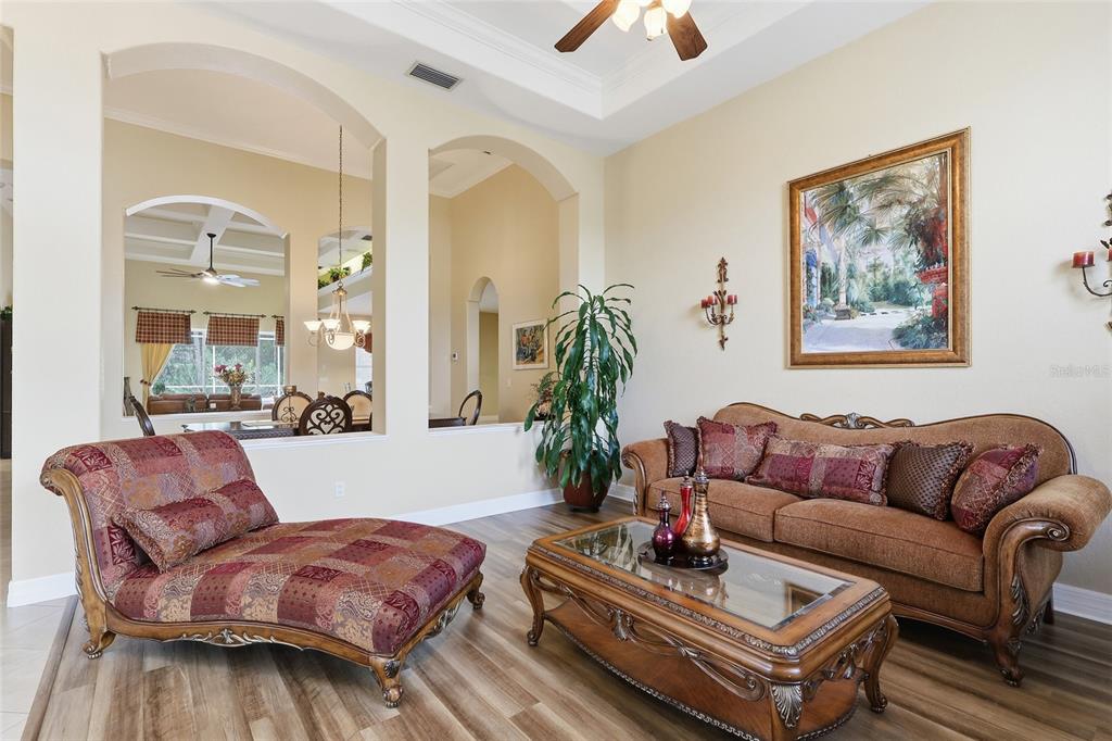 11749 Newberry Grove Loop Riverview, FL 33579 - Photo 6 of 54 a living room with furniture a glass table and a large mirror