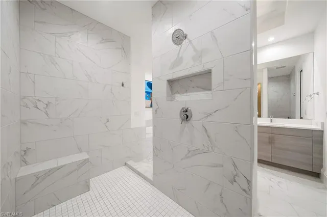 a bathroom with a bathtub and a shower