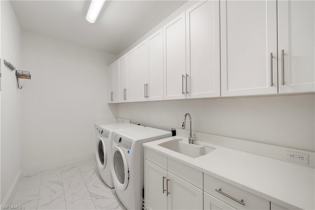 875 6th Avenue South, Unit 304 Naples, FL 34102 - Photo 24 of 40 a utility room with sink dryer and washer
