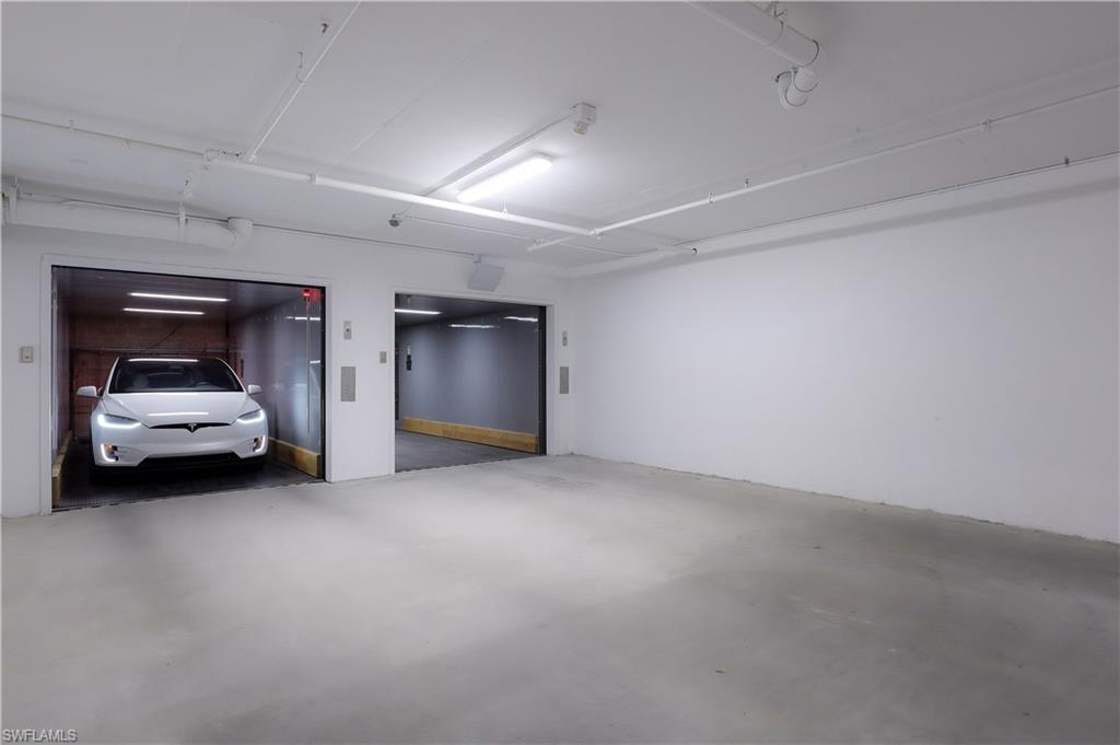 875 6th Avenue South, Unit 304 Naples, FL 34102 - Photo 38 of 40 a view of car parking