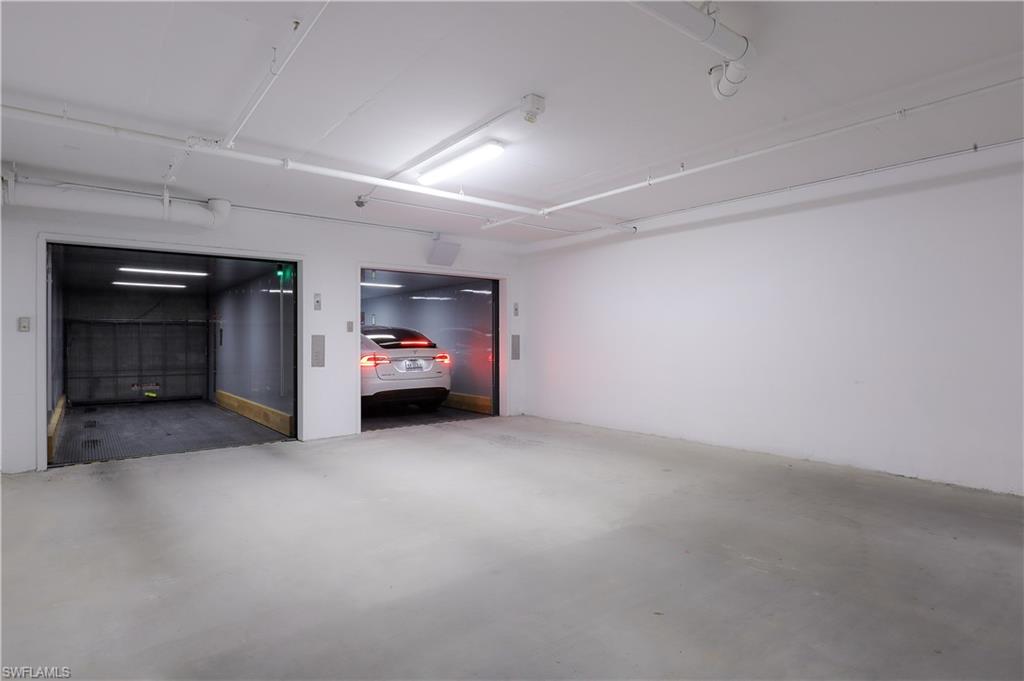 875 6th Avenue South, Unit 304 Naples, FL 34102 - Photo 39 of 40 a view of empty room with a fireplace