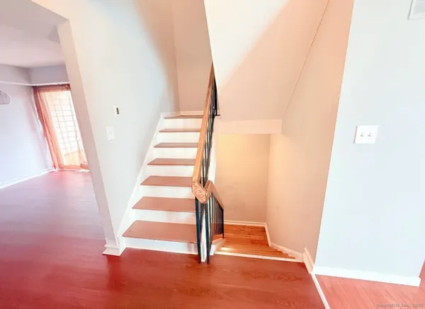 a view of entryway with wooden floor