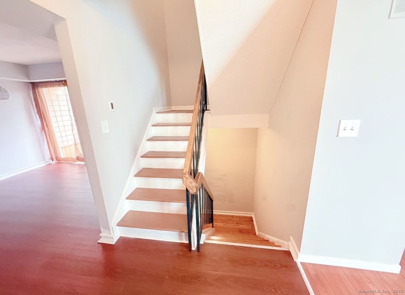 a view of entryway with wooden floor