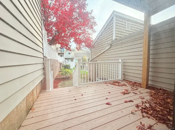 a view of a house with a wooden fence
