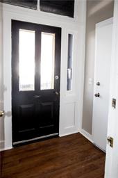 344 Bushkill Street, Unit 2 Easton, PA 18042 - Photo 4 of 30 Welcome guests through a classic black entry door, framed by white molding and clear glass sidelights.